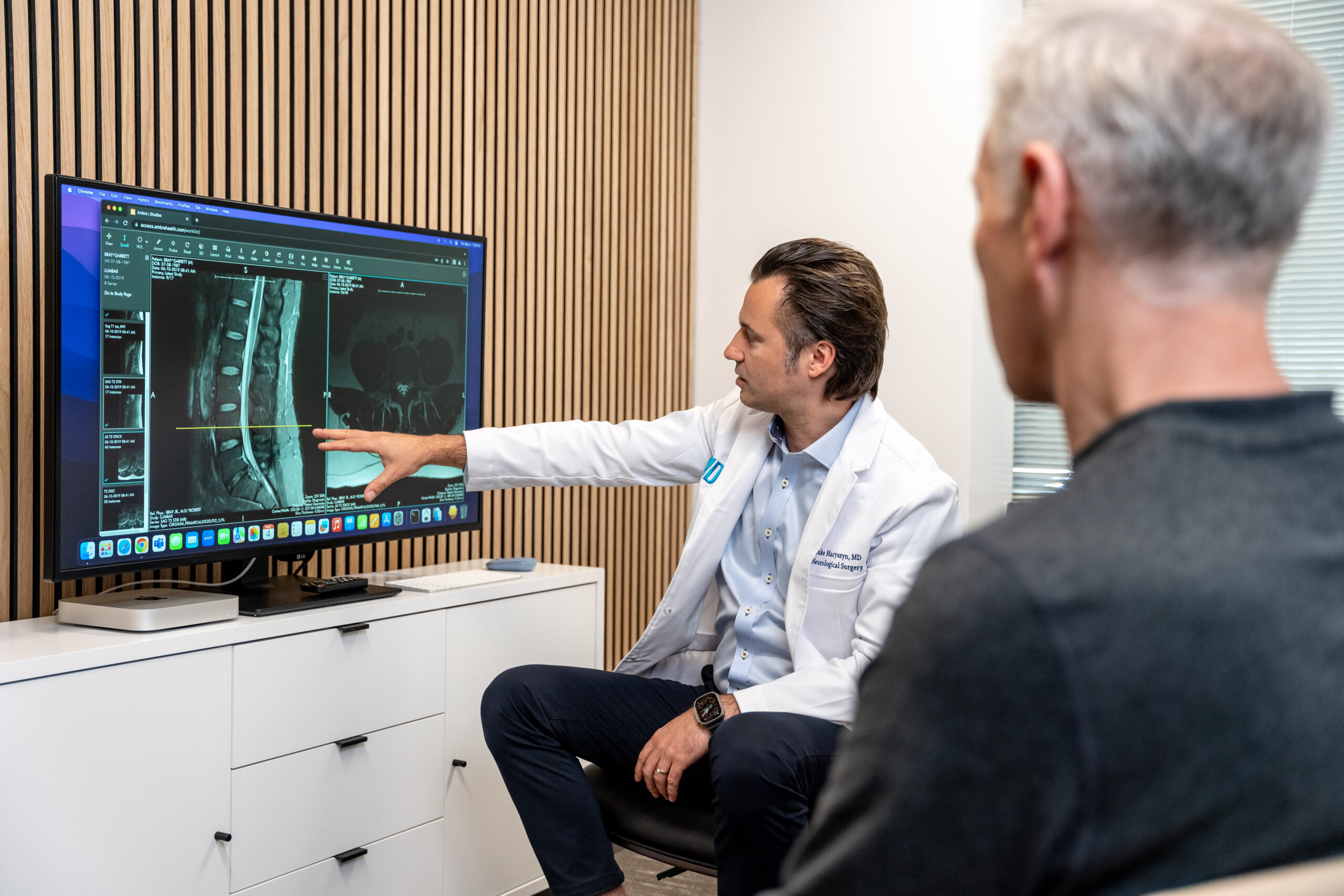 Dr. Macysyzn showing results to his patient