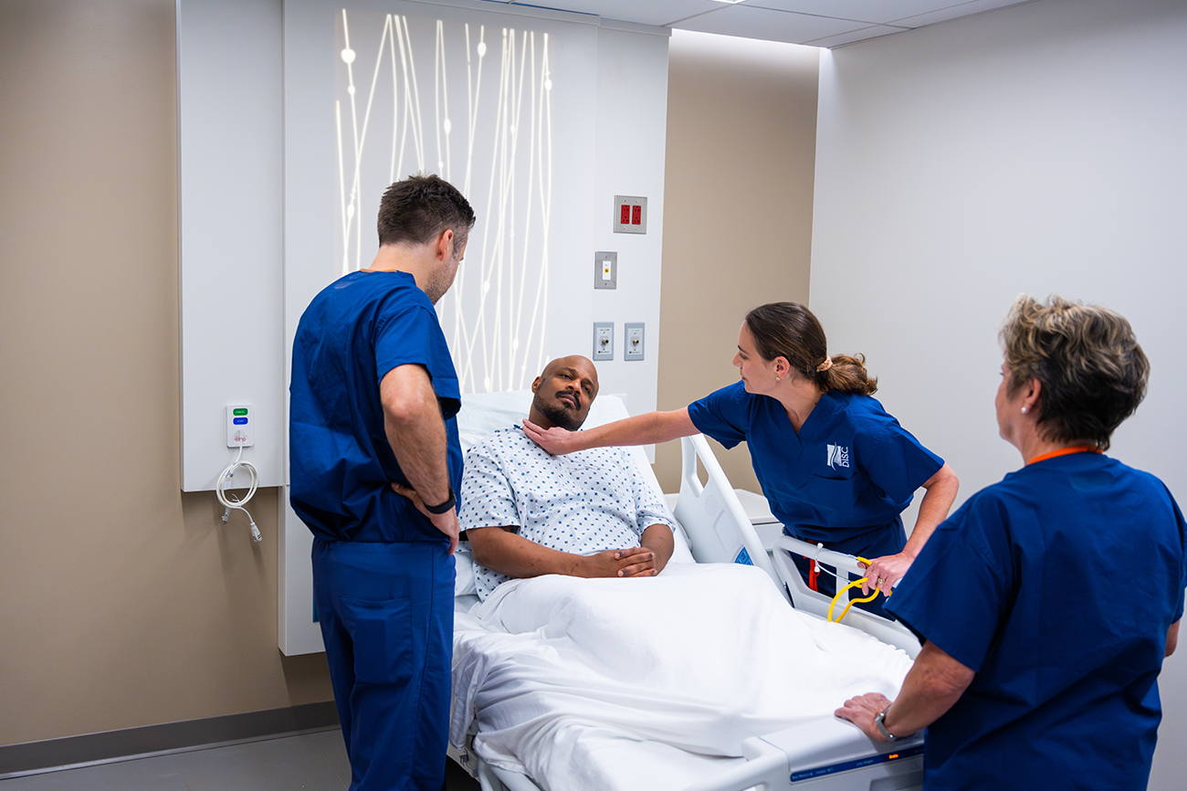 Healthcare providers helping patient