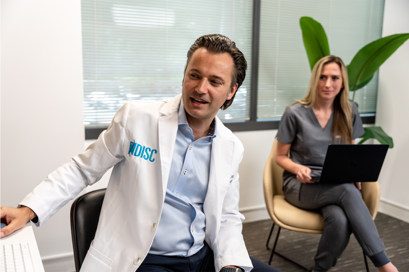 Dr. Macyszyn and assistant
