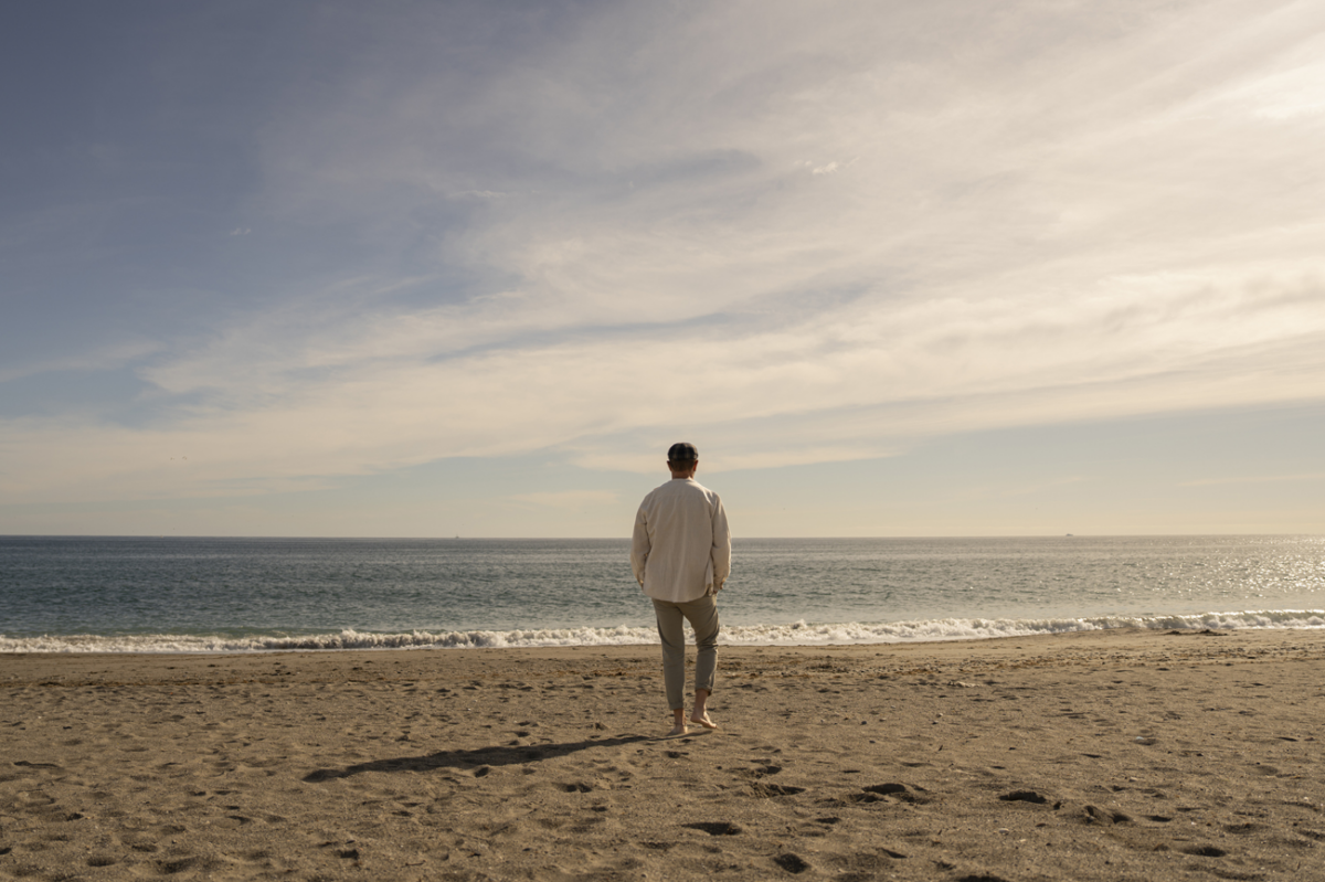 man walking on beach
