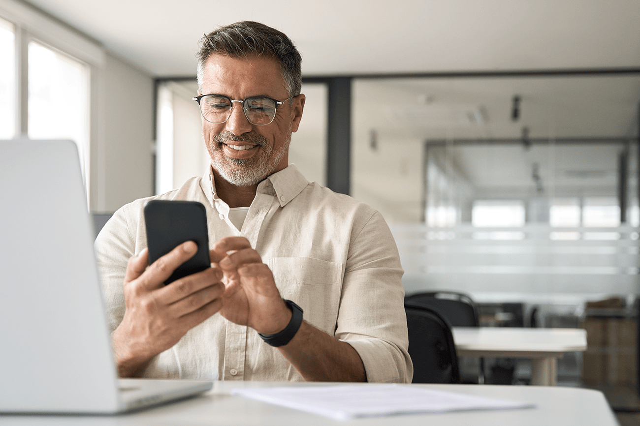 Middle aged man looking a phone